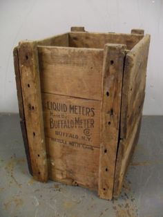 an old wooden crate sitting on top of a table