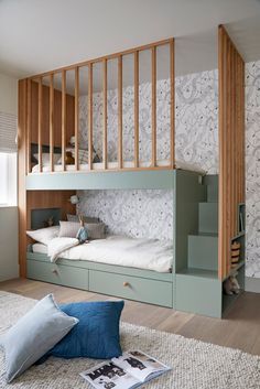 a bedroom with bunk beds and stairs in it