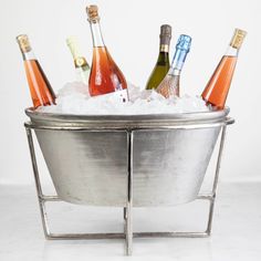 Five bottles of sparkling wine chilling in an ice-cold, Bidk Home Extra Large Nickel Party Bucket on Stand. Large Ice Bucket, Party Bucket, Wine Cooler, Ice Bucket, Nickel Finish, Table Setting, Extra Large, Presentation, Beer