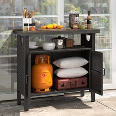 a shelf that has some food on top of it and two suitcases sitting next to it