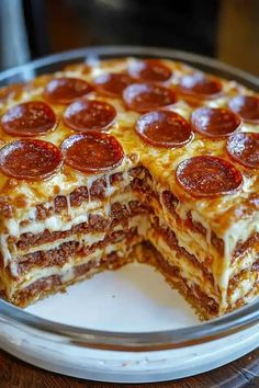 a pizza cake is cut in half on a plate