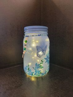 a glass jar with some lights in it