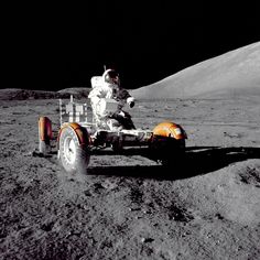 an astronaut on the moon next to a vehicle