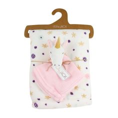 a pink blanket with a unicorn on it and a tag hanging from the top of it