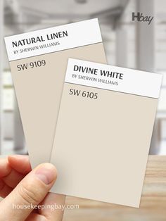 The image presents a comparison of two Sherwin Williams paint colors. On the left is "Natural Linen" (SW 9109), a warm beige with soft tan undertones. On the right is "Divine White" (SW 6105), a lighter and creamier off-white with warm undertones. Both samples are shown side by side, allowing for a clear contrast between the slightly deeper, more beige tone of Natural Linen and the lighter, softer warmth of Divine White. Divine White Sherwin Williams, Sw Divine White, Sherwin Williams Natural Linen, White Sherwin Williams, Divine White, Bathroom Sink Units, Yellow Paint Colors, Home Planning, House Colours