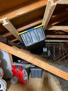 the attic is filled with tools and supplies for repair, including an air conditioner