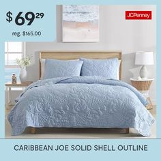 a bed with blue comforter and pillows on it for $ 699 99 reg $ 156 00