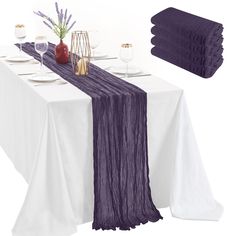 the table is set with place settings and napkins