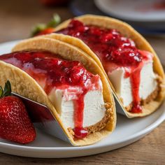 two tacos on a plate with strawberries