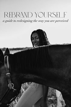 a black and white photo of a woman petting a horse