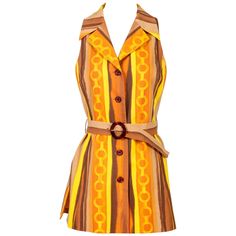 A signature equestrian motif gets the mod treatment in this amazing Céline vest. The horse bit, first designed by the French luxury brand in the early Seventies and still prominently used in its coveted accessories, is linked to form a chain, which appears within gorgeous vertical painterly stripes of yellow, orange, brown and tan. The stripes visually elongate the cotton tunic silhouette, which is smartly appointed with a notched collar, vertical front slit pockets, side slits and a fabric belt 1stdibs Fashion, 70s Wardrobe, Glitter Vest, Clown Ideas, Toru Hagakure, Vintage Waistcoat, 60s Vibes, Belted Tunic, Tunic Vest