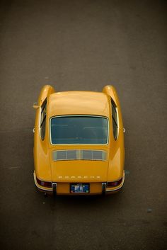 an overhead view of a yellow sports car