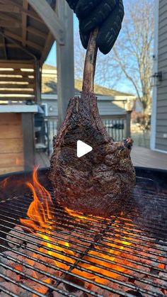 a steak is being cooked on the grill