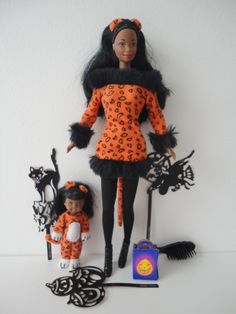 an image of a doll with two dolls