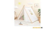 a child's teepee tent in the corner of a room