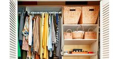 an organized closet with clothes and baskets