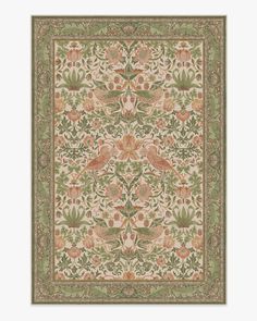 an intricately designed rug with birds and flowers in green, pink, orange and yellow