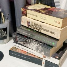 a stack of books sitting on top of a table