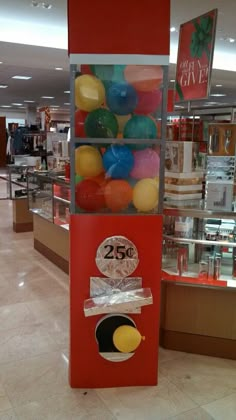 a vending machine in a store filled with lots of balloons