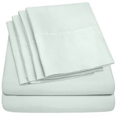 four white sheets folded on top of each other