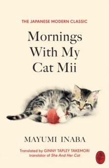 a book cover with a kitten laying on top of a ball and the title'mornings with my cat mii '