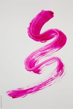 the letter s is painted in bright pink and has long, wavy lines on it