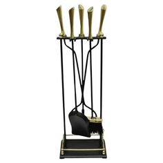 a black and gold metal rack with four knives on it's sides, one holding a purse