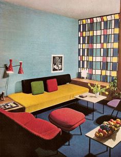 a living room filled with furniture and colorful walls