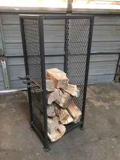 a pile of wood sitting inside of a metal container