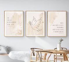 three framed art prints hang on the wall above a table with chairs and a bench