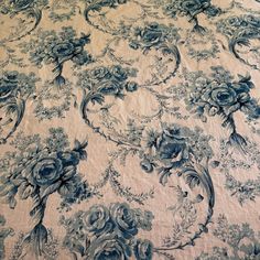 a blue and white floral pattern on a bed sheet