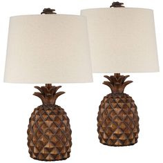 pair of pineapple lamps with white shades