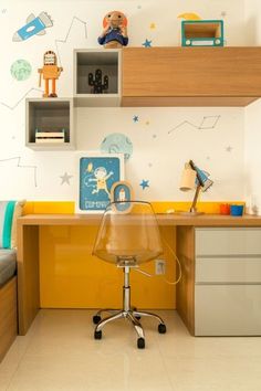 a child's room with a desk, chair and bookshelf in it