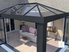 an image of a living room with glass walls on the roof and windows in the wall