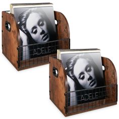 two wooden magazine racks with marilyn monroe pictures on the front and sides, one holding an album