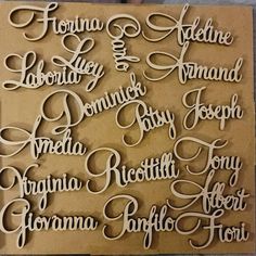 some type of paper cut out with different names on the front and back of it