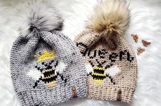 two knitted hats with bees on them, one has a pom - pom