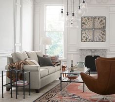 a living room filled with furniture and a fire place