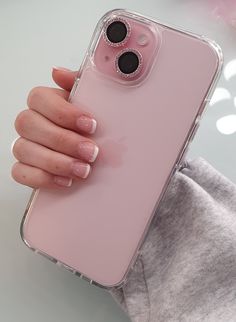 a woman's hand holding an iphone case with the camera lens on her phone