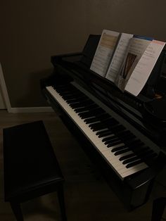 a piano with sheet music sitting on top of it