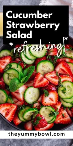 cucumber strawberry salad with mint and fresh strawberries in a bowl on a table