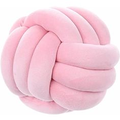 a pink ball that is on top of a white surface and has been made out of foam