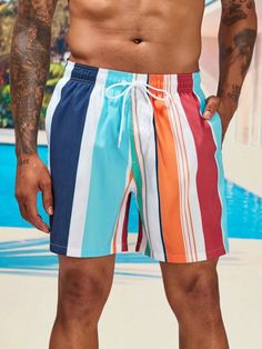 Make a statement with our Colorful Striped Swim Shorts. These swim shorts feature a captivating combination of bold and vibrant colors in a striped pattern, creating a lively and energetic look. The colorful stripes add a sense of fun and individuality to your swimwear, making it a perfect choice for beach outings or poolside lounging. Details: Pattern Type: Striped Details: Patched, Drawstring Type: Bottoms Bottom Type: Shorts Fabric: Non-Stretch Composition: 100% Polyester Care Instructions: M Multicolor Swimwear With Built-in Shorts For Vacation, Orange Shorts For Poolside And Beach Season, Multicolor Swim Trunks With Built-in Shorts For Beach Party, Beachy Multicolor Swim Trunks For Summer, Multicolor Swimwear With Built-in Shorts For Beach, Multicolor Short Swim Trunks For Beach Party, Striped Swim Trunks For Swimming, Striped Swim Trunks For Beachwear, Striped Swim Trunks For Swimming Beachwear