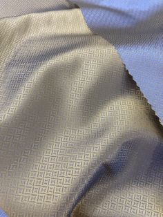 an up close shot of a blue and white fabric