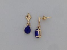 "SOLID 14KT YELLOW GOLD DANGLE EARRINGS NATURAL SAPPHIRE IS 5x7 mm PEAR SHAPE EACH  SAPPHIRE IS CABOCHON CUT NATURAL DIAMOND IS 0.02 TCW EARRING LENGTH IS 5/8\" INCH COMES IN GIFT BOX" How To Wear Earrings, Yellow Gold Drop Jewelry With Prong Setting, Gold Dangle Earrings, Diamond Dangle Earrings, Dope Jewelry, Classy Jewelry, Silver Jewelry Fashion, Jewelry Lookbook, Funky Jewelry