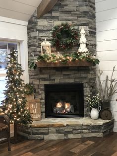 the fireplace is decorated with christmas decorations