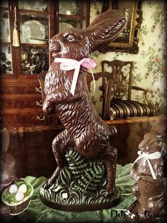 a chocolate bunny statue sitting on top of a table