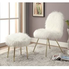 a white chair and foot stool in a room with a rug on the floor next to a window