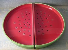 two red plates with holes cut in half