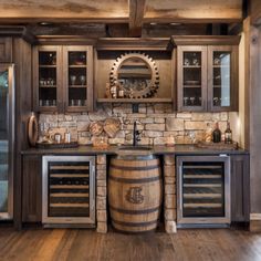 a wine barrel in the middle of a kitchen with built - in wine coolers